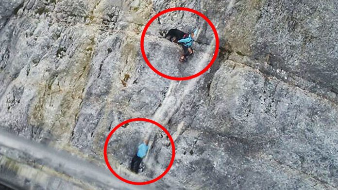 Bergrettung Hubschrauber von zwei Wanderinnen Berner Sennenhund